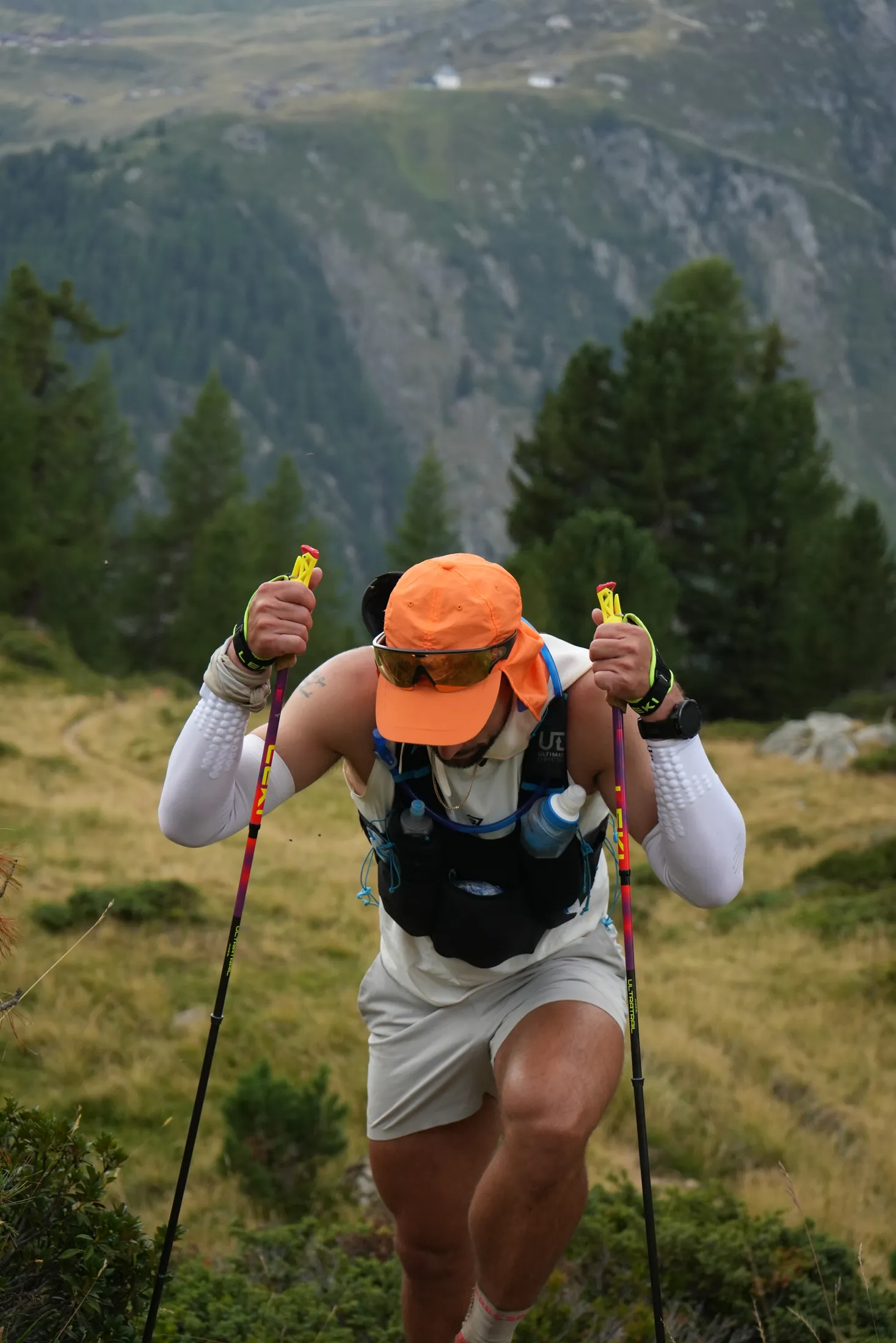 Alex Grabher, founder of AG Performance, climbing during an ultra-distance mountain race